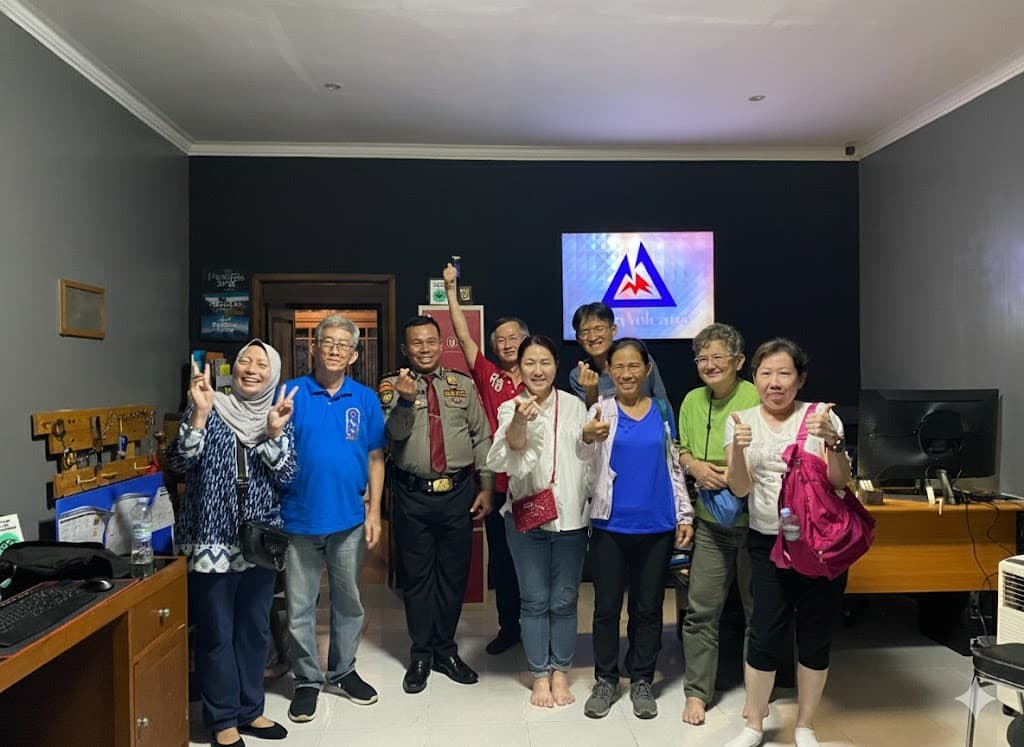 International travelers posing at JVTO Bondowoso operations office